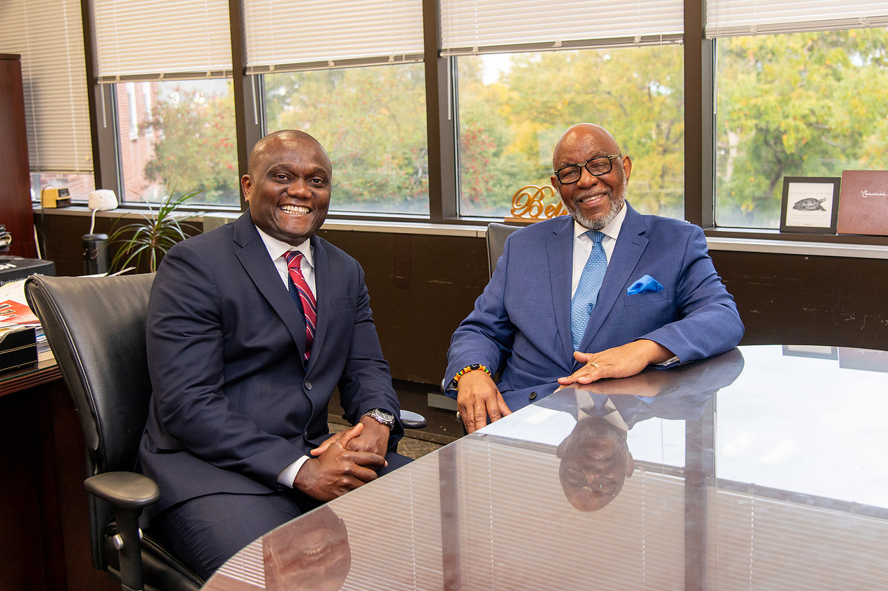 Dr.Jerry L. Lewis, Mr. Savage and others pose for a photo with Senator Hillary Clinton.