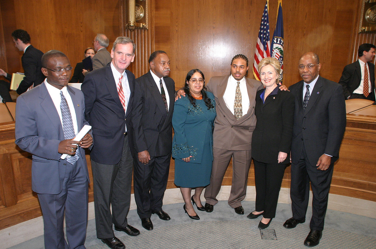 Dr.Jerry L. Lewis, Mr. Savage and others pose for a photo with Senator Hillary Clinton